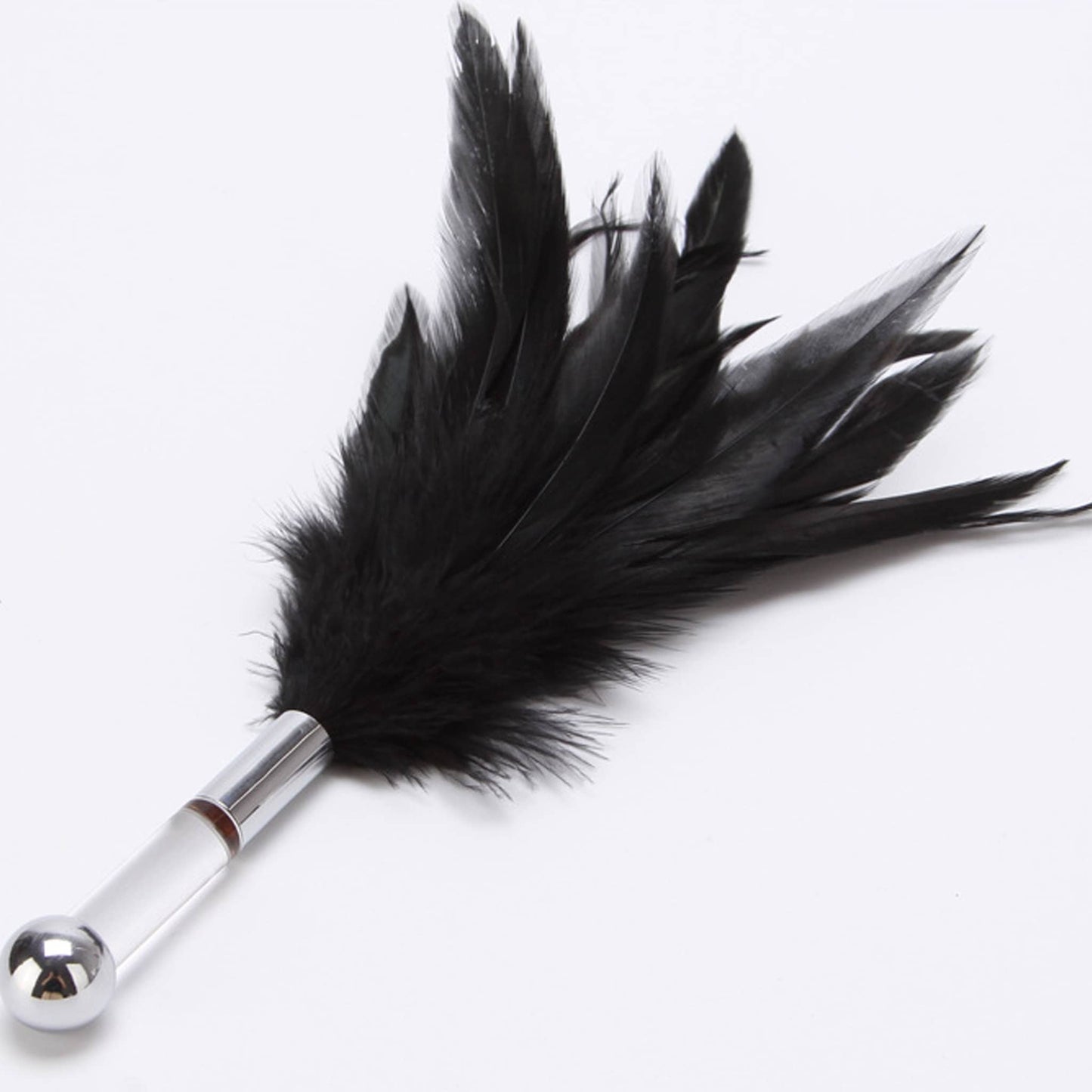 Black feather tickler with a clear acrylic handle and a silver metal ball, used for sensory teasing and foreplay.
