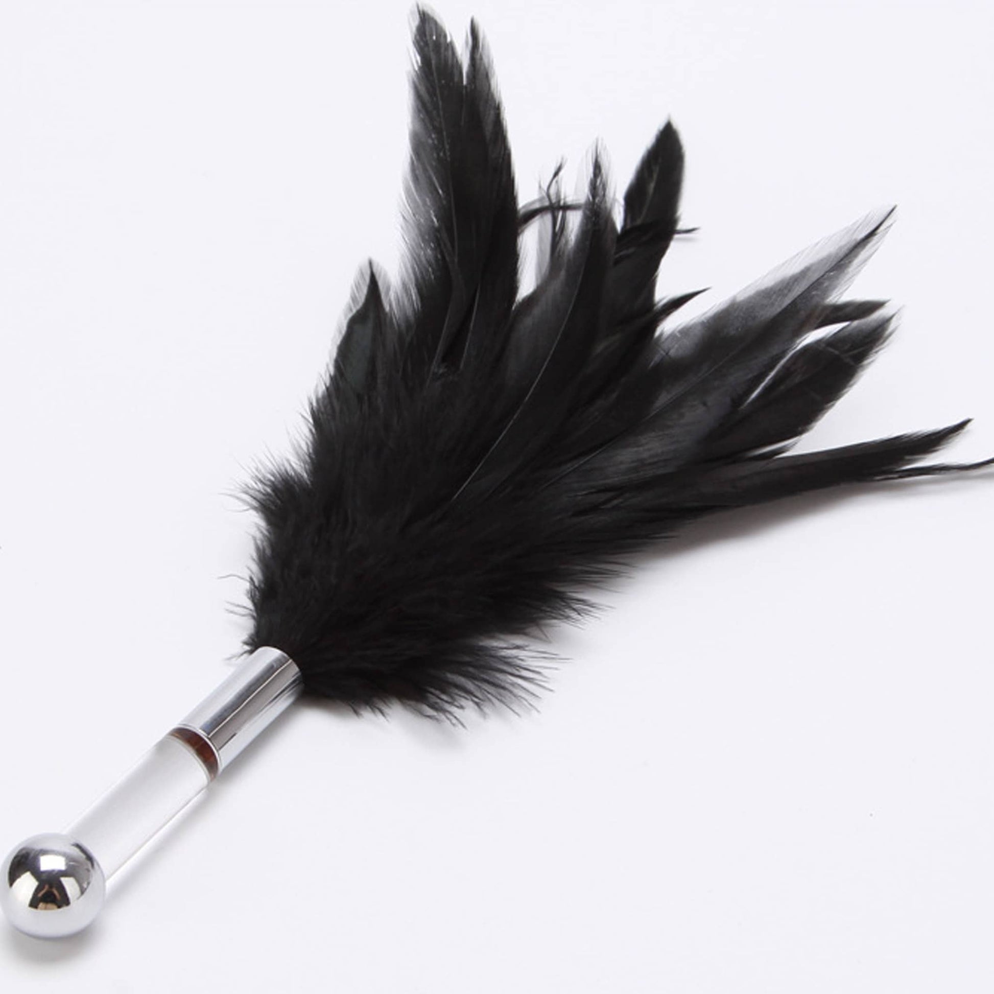 Black feather tickler with a clear acrylic handle and a silver metal ball, used for sensory teasing and foreplay.