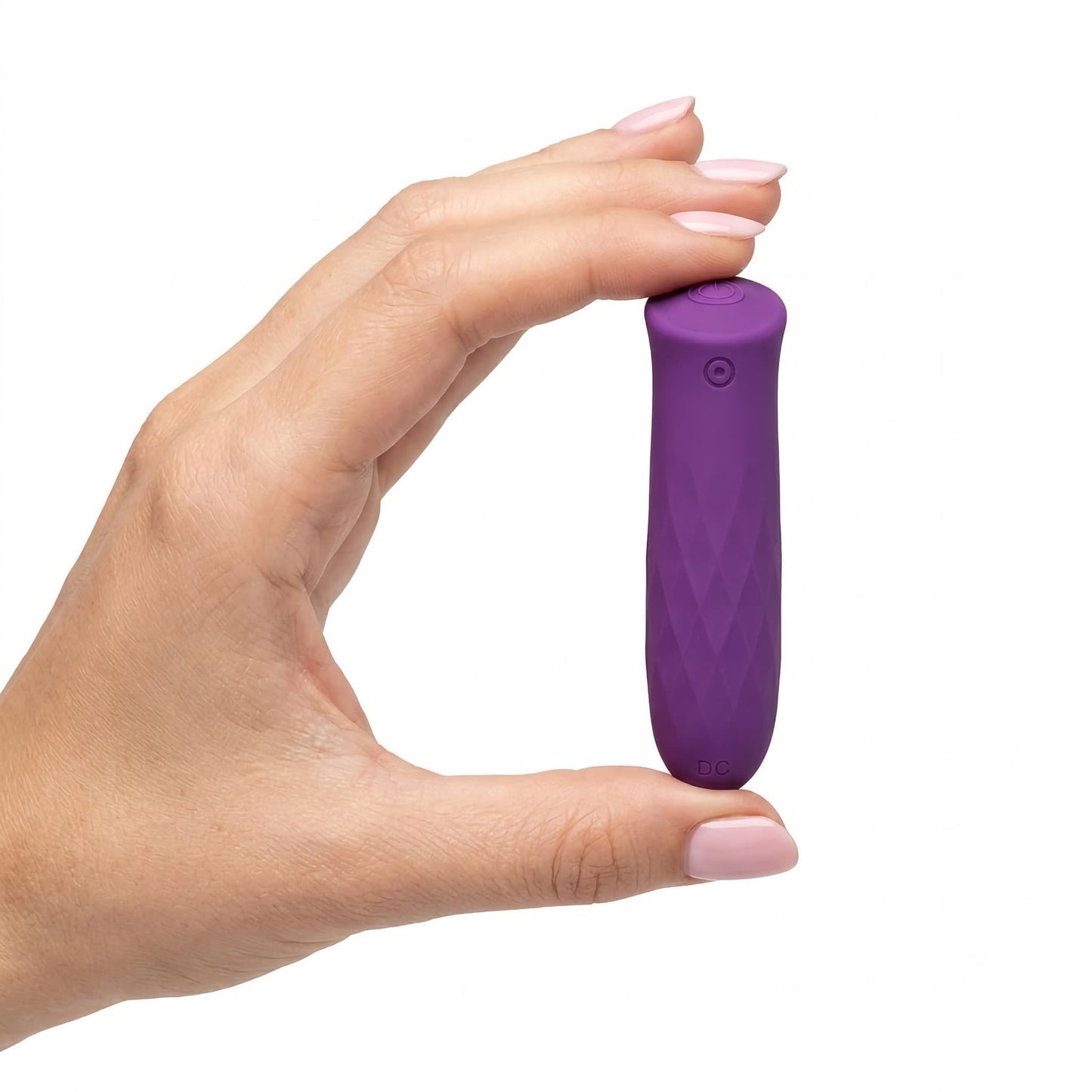 Clean product photo showing a manicured hand with pink nail polish gently holding the deep purple massager between the thumb and forefinger, providing a scale comparison to emphasize its small, discreet, and pocket-sized design.