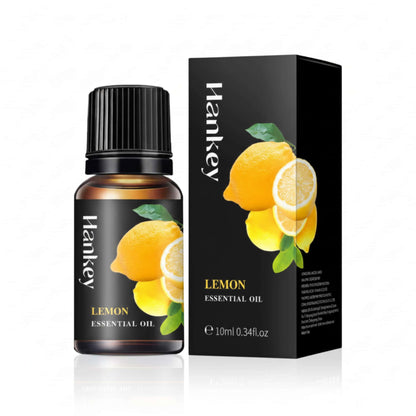 Lemon Essential Oil bottle and its black packaging box displayed on a pure white background for e-commerce.
