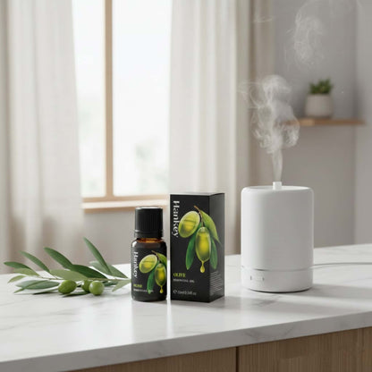 Olive sensual oil bottle with fresh olive leaves and a minimalist diffuser, creating a luxurious, comfortable, and nourishing intimate atmosphere.