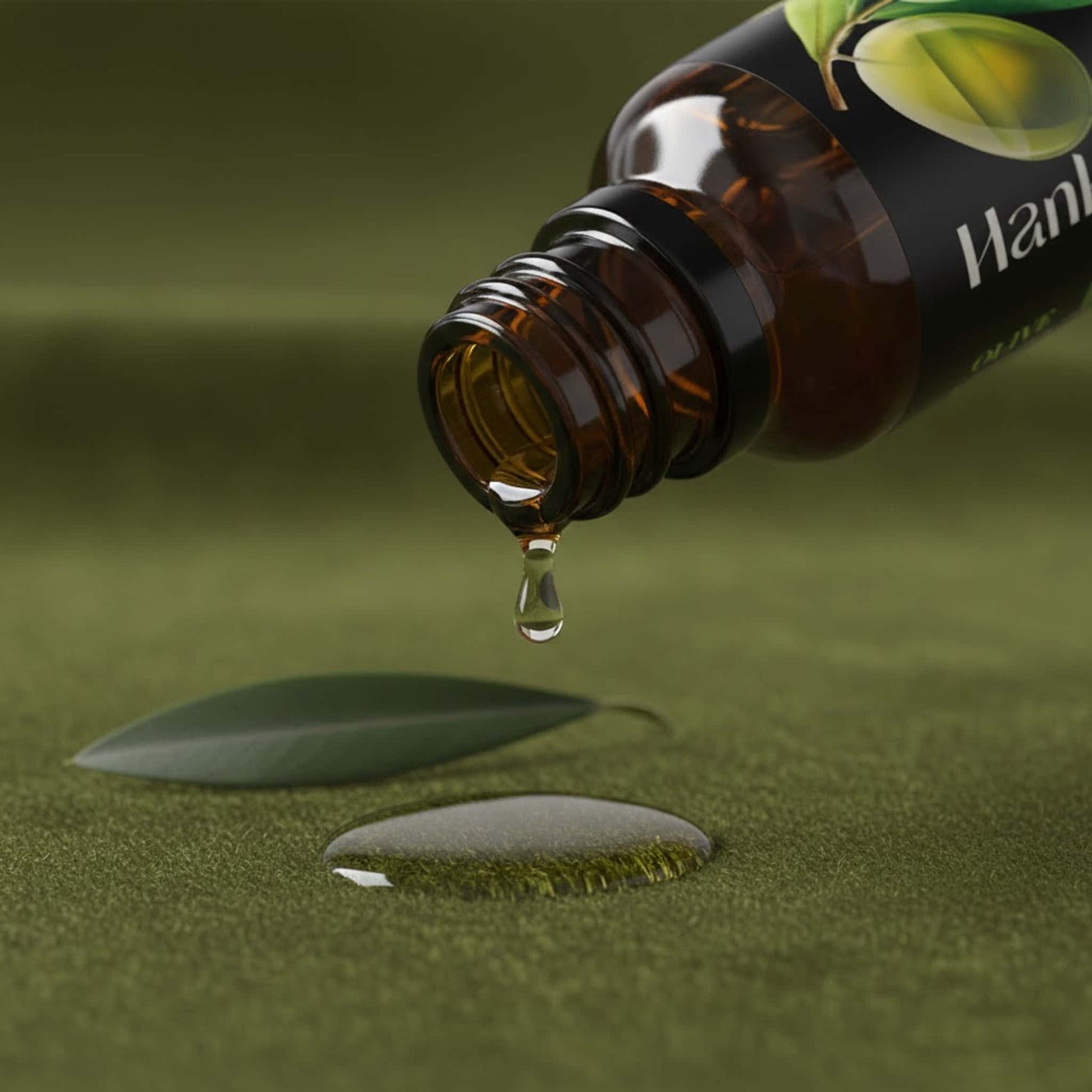 Macro shot of Olive essential oil dripping from the bottle neck onto luxurious deep olive green velvet fabric, emphasizing its rich texture and dropper dispenser.