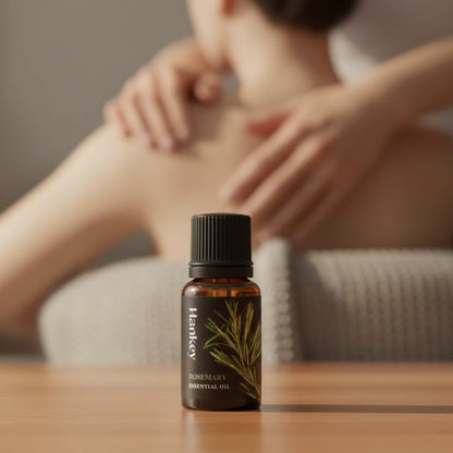 Rosemary invigorating sensual oil in the foreground, with blurred figures in the background showing focused intimate connection and vitality.