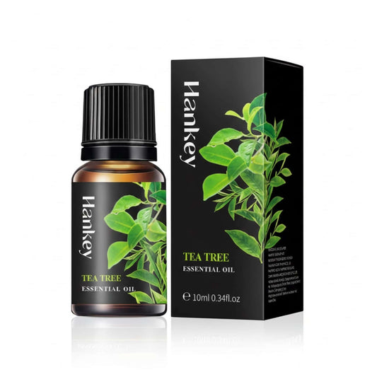 Tea Tree Essential Oil bottle and its black packaging box displayed on a pure white background for e-commerce.