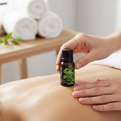 Hand gently massaging Tea Tree purifying sensual oil onto clean skin for a refreshing and revitalizing experience.